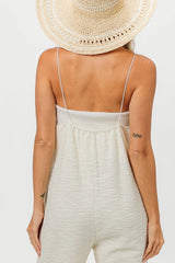 Tweed jumpsuit with pockets