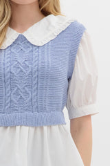Ruffled collard white top with sweater vest over