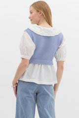 Ruffled collard white top with sweater vest over